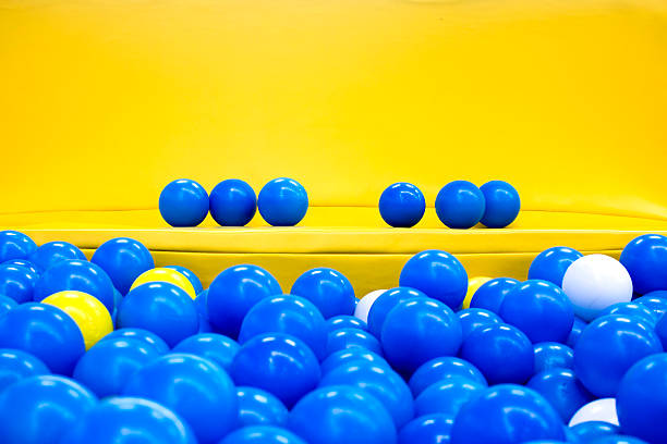 six blue balls on the yellow bench stock photo