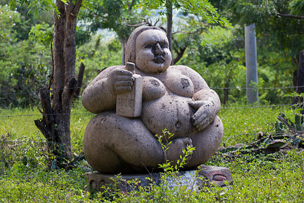 Stone sculpture representing a fat woman