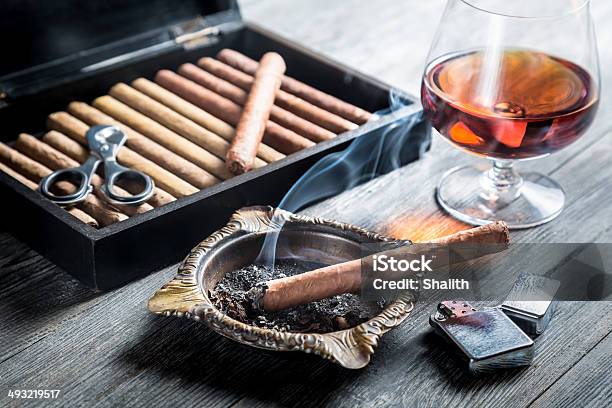 Aroma Of Cognac And Cigar Fuming Stock Photo - Download Image Now - Ashtray, Cigar, Achievement