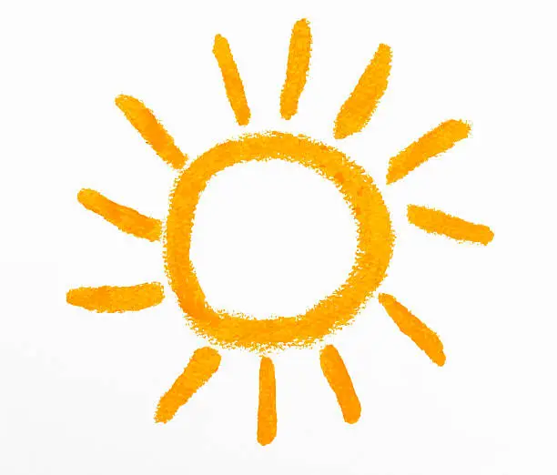 Photo of Isolated shot of crayon drawing the Sun on white background