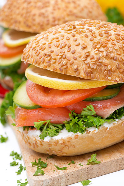 istock burger with smoked salmon and vegetables, close-up 493224229