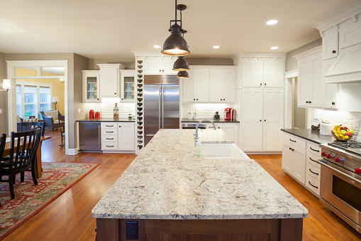 Open Concept Kitchen and Dining Room With Marble Center Island