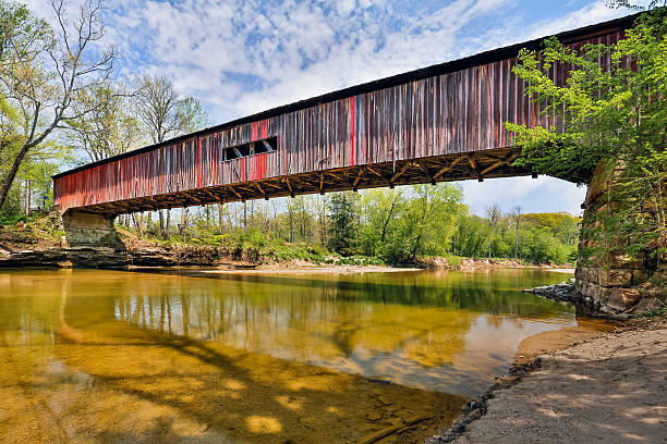 Covered Bridge at Cox Ford Cox Ford Covered Bridge, built in 1913, crosses Sugar Creek along the west edge of Indiana's Turkey Run State Park. indiana covered bridge stock pictures, royalty-free photos & images