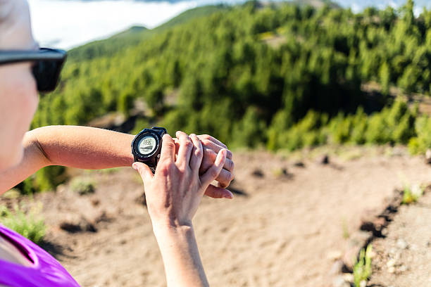istock Trail runner looking at sport watch 493224939