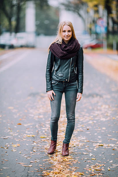 istock Young woman with autumn leaves on the head. 493236332