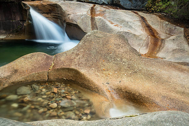 istock Waterfall at The Basin granite pothole, White Mountains, New Ham 493236458