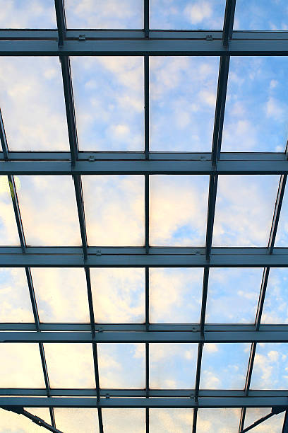 istock glass roof in building on blue sky 493237152