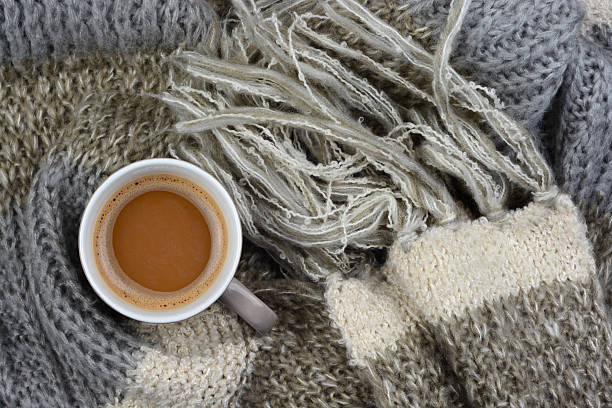 istock Hot chocolate in coffee mug cup with knitted scarf blanked 493239154