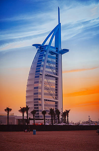 Dubai, United Arab Emirates - March 25, 2015: Luxury hotel Burj Al Arab and Jumeirah Beach in Dubai, United Arab Emirates, Asia. Burj Al Arab has been called \