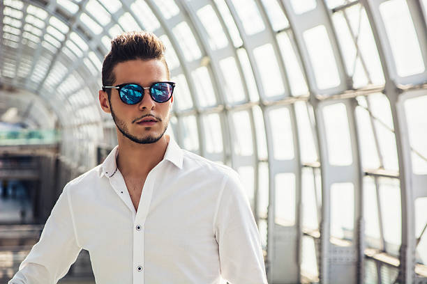 istock Handsome young man in train station or airport 493240102