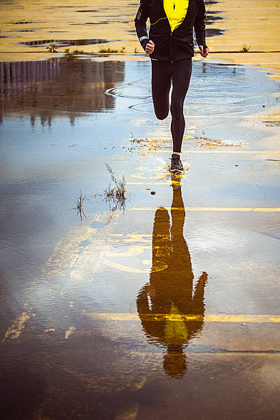 istock Young person running over the yellow parking lot 493240132