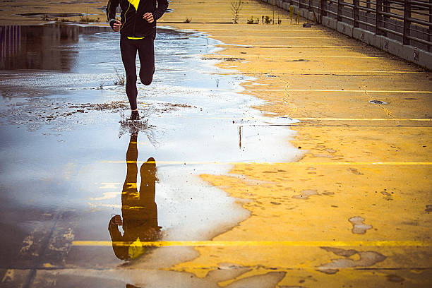 istock Young person running over the yellow parking lot 493240166