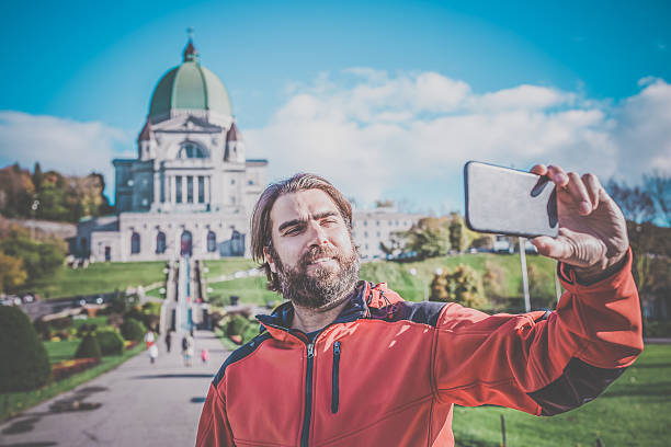 istock Man Doing Selfie in Front of Saint Joseph's Oratory, Montreal 493241394