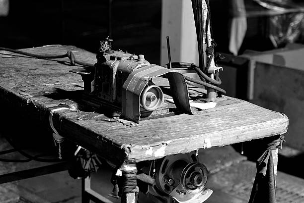istock Old sewing machine formally used in textile factory 493242046