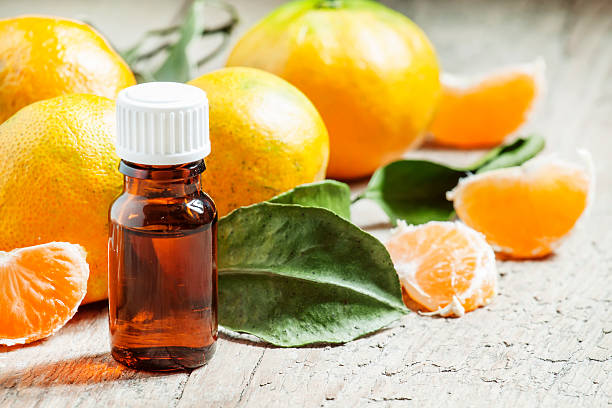 istock Aromatic tangerine oil, with tangerines 493244294