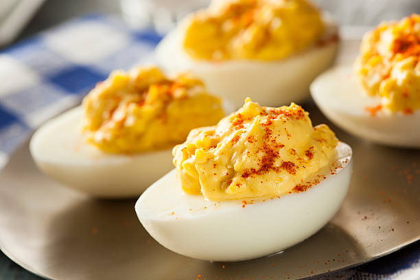 Healthy Deviled Eggs as an Appetizer Healthy Deviled Eggs as an Appetizer with Paprika boiled egg photos stock pictures, royalty-free photos & images