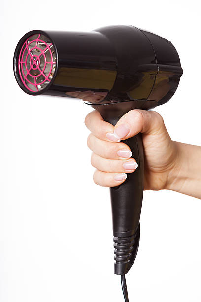 istock Hand with hair dryer 493245503