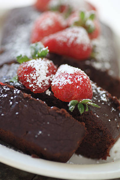 istock Closeup view of chocolate loaf cake with berries 493246854