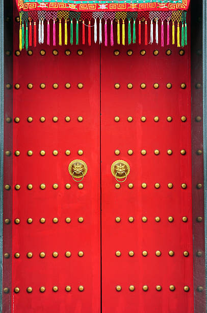 istock Red chinese door with a lion hand door 493246983