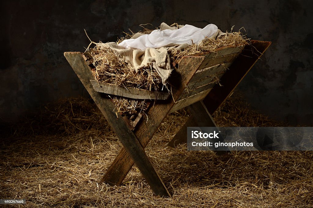 Manger in Stable Manger with hay and swaddling clothes in old stable Nativity Scene Stock Photo