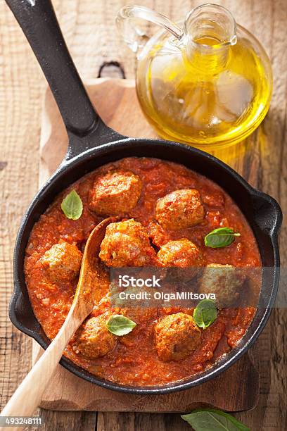 Meatballs With Tomato Sauce In Black Pan Stock Photo - Download Image Now - Basil, Beef, Black Color