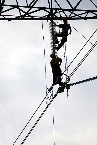 istock Maintenance of a power line 493248471