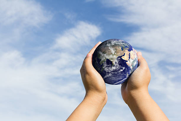 istock hands holding earth. Elements of this image furnished by NASA 493248656