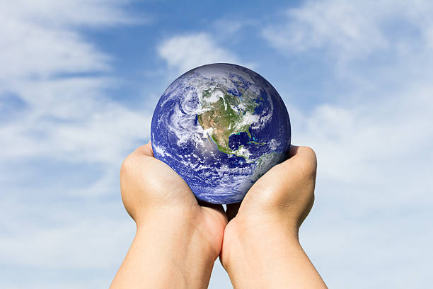istock hands holding earth. Elements of this image furnished by NASA 493248684