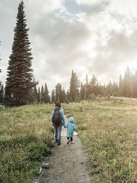 istock mother hiking with daughter at MT.Rainier 493248722