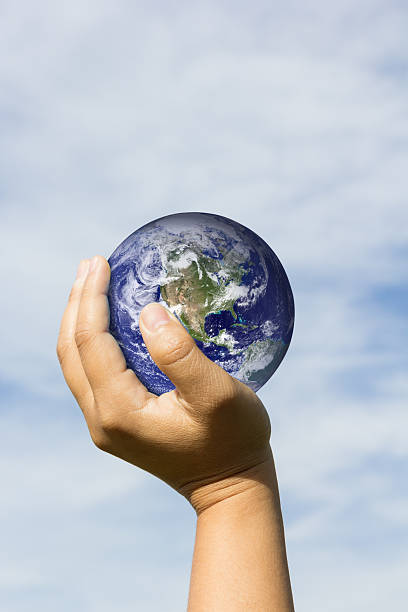istock hand holding earth. Elements of this image furnished by NASA 493248724