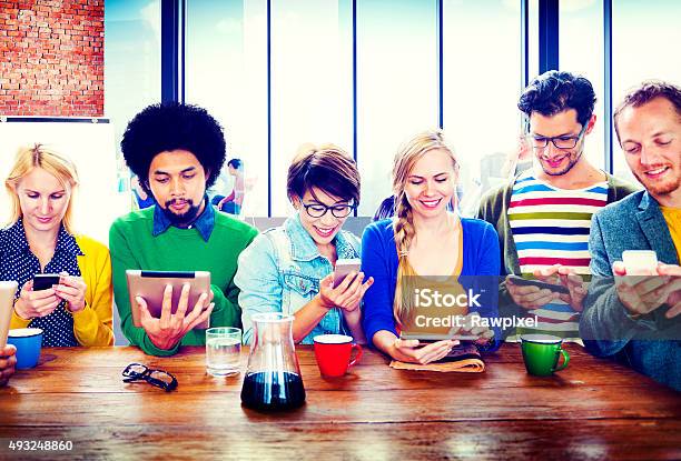 Diverse People Digital Devices Wireless Communication Concept Stock Photo - Download Image Now