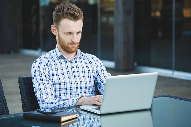 istock Handsome businessman working with laptop 493249375