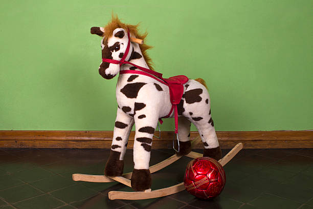 istock Rocking horse and red ball 493250159