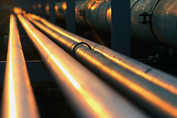 istock long pipe line in oil refinery during sunset 493250681