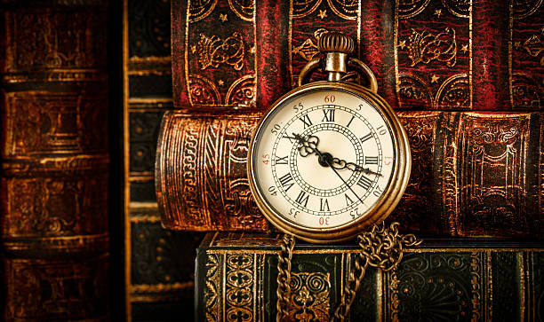 istock Old Books and Vintage pocket watch 493250904