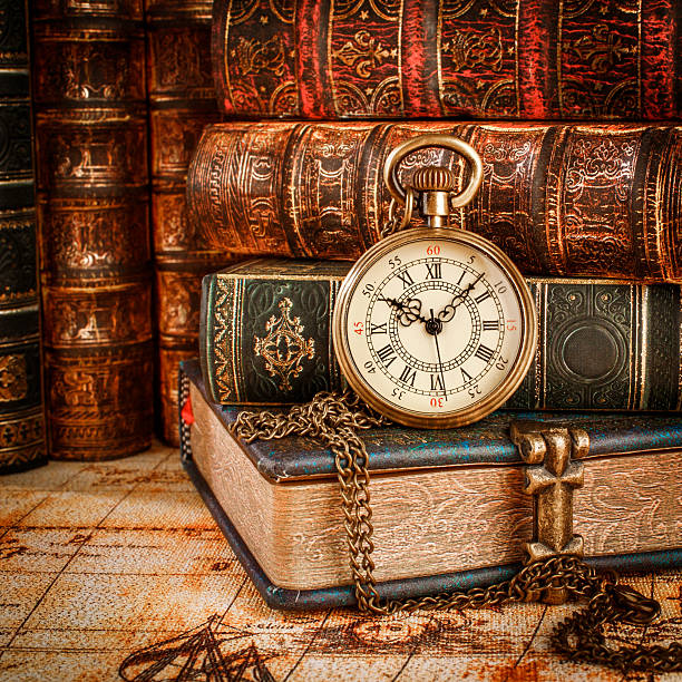 istock Old Books and Vintage pocket watch 493251000