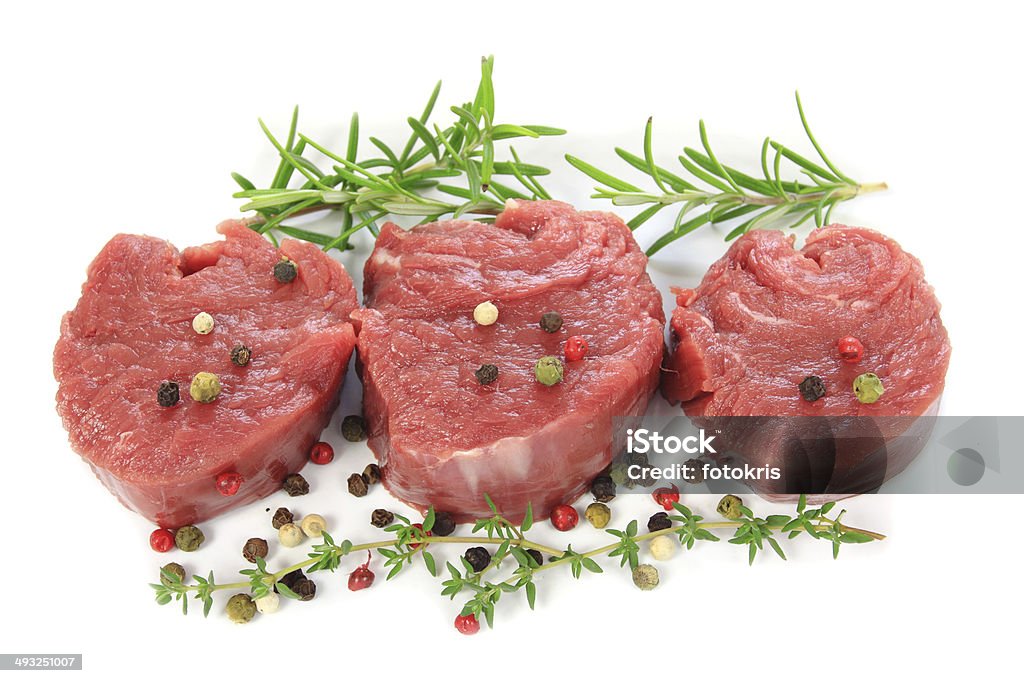 Sirloin steak Raw sirloin steak with spices on a white background Beef Stock Photo