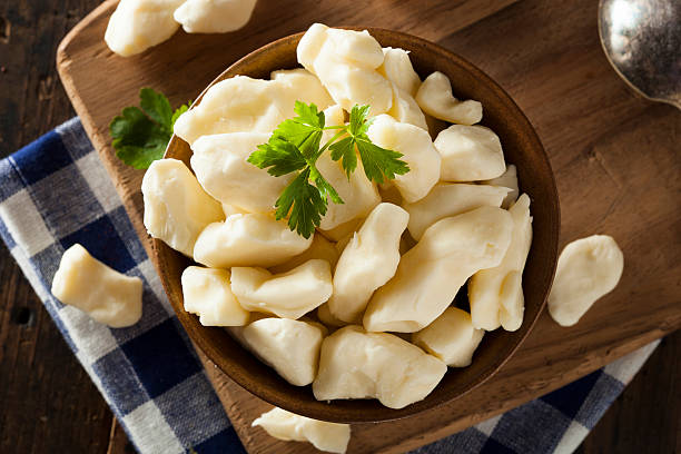 White Dairy Cheese Curds White Dairy Cheese Curds in a Bowl curd cheese stock pictures, royalty-free photos & images