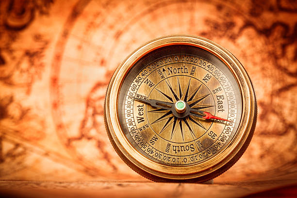 istock Vintage compass lies on an ancient world map. 493251762