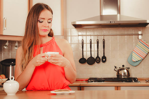 istock Woman with gingerbread cookies drinking tea coffee 493268602