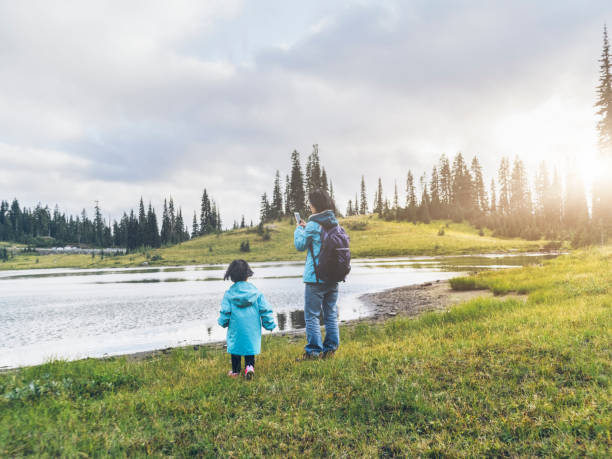 istock mother taking picture with daguhter  at MT.Rainier 493270390
