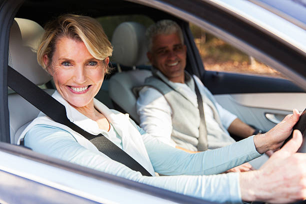 istock senior couple travelling in a car 493270394