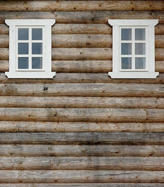istock Log Cabin Wall With Two Ornamental Windows 493270744