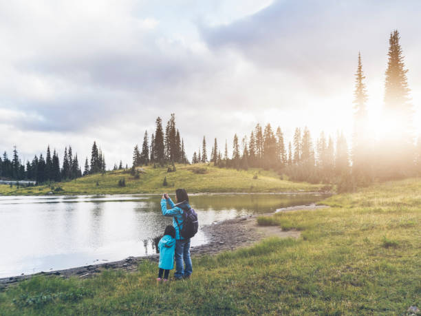 istock mother taking picture with daguhter  at MT.Rainier 493271232
