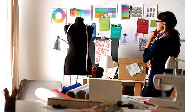 istock Beautiful fashion designer standing in studio 493273914