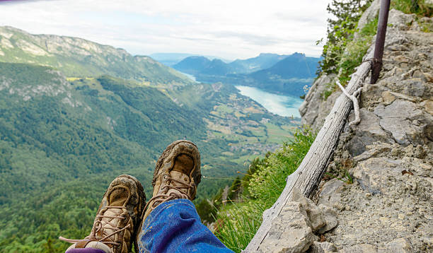 istock backpacker shoes at the edge of a trail, 493276076