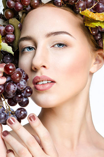 istock The girl with grapes 493276278