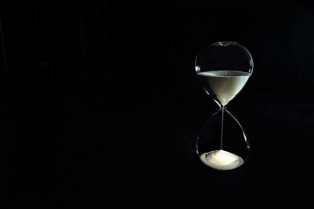istock Hour Glass on the black background 493278642