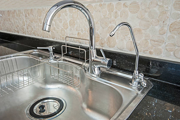 istock Closeup of a metal kitchen sink 493279182