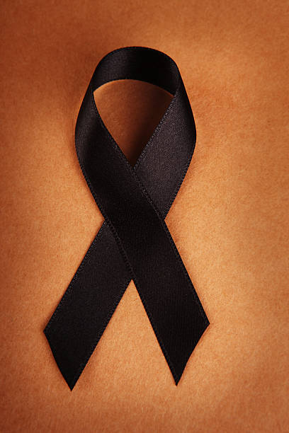 istock Black Awareness Ribbon on Brown 493279227